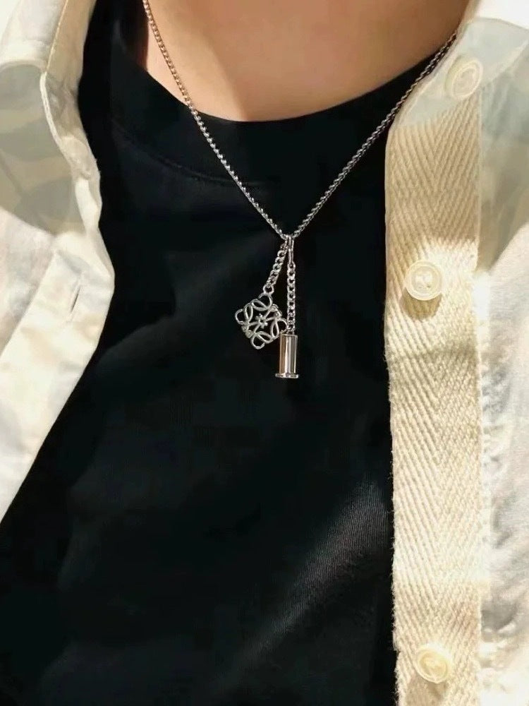  A model with a sleek, modern style wearing the necklace with a simple top, demonstrating its effortless elegance.