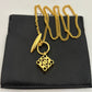  Clean, crisp shot of the necklace laid flat or worn, against a solid neutral background, focusing on the pendant and delicate chain.