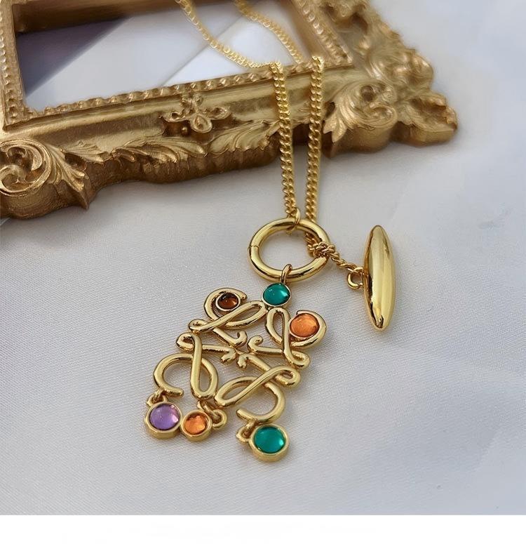 Vibrant, high-resolution shot of the necklace against a clean, neutral background to make the colorful stones the absolute focal point.
