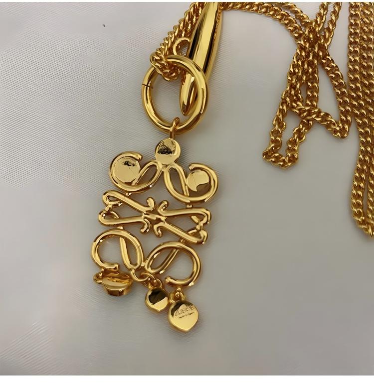 The necklace displayed on an artist's palette or next to a stack of colorful art books, reinforcing its creative and luxurious essence.