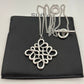 Clean shot of the necklace laid flat or styled in a loose loop, showcasing the pendant and the substantial chain.