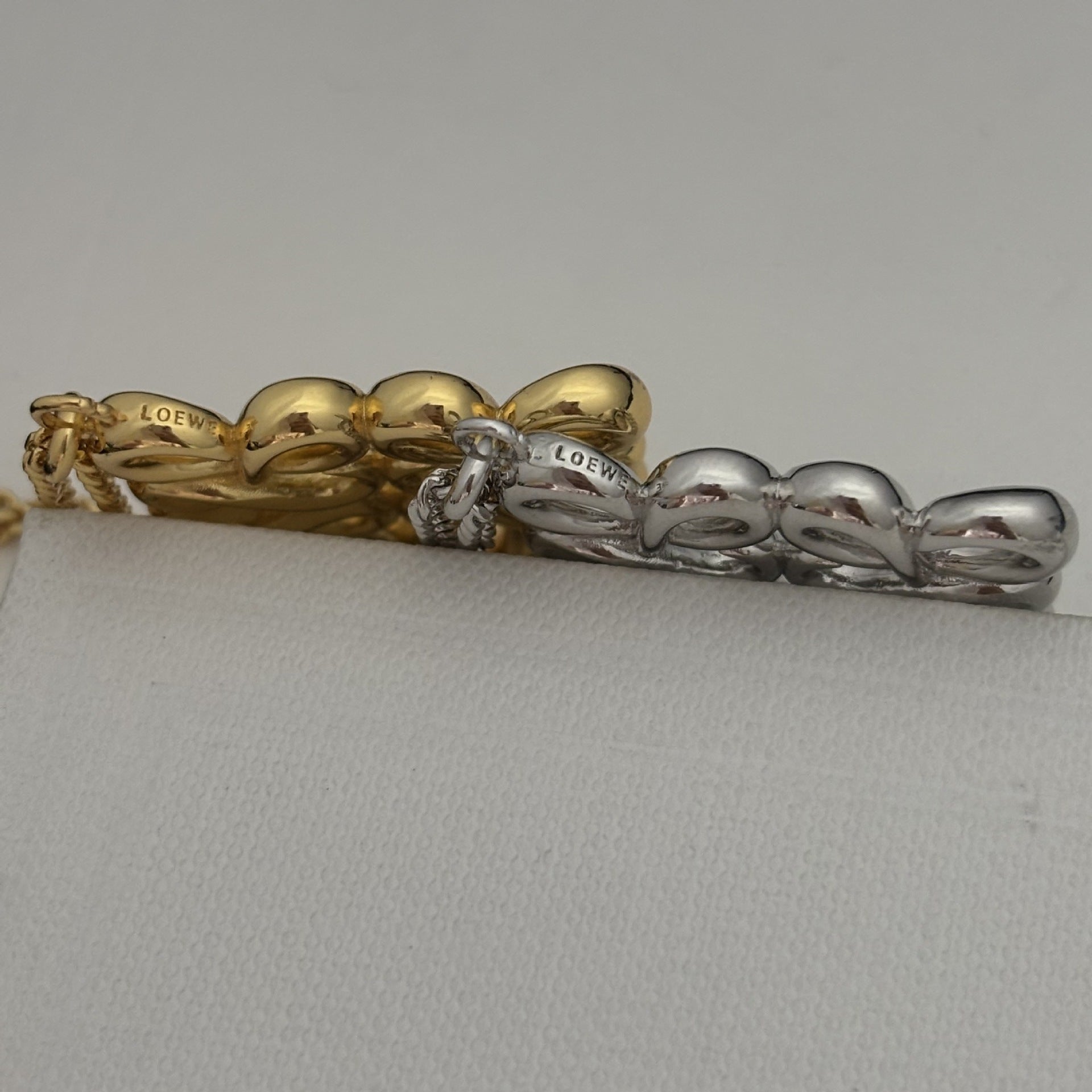  Lifestyle image of the necklace being worn over a plain cashmere sweater or turtleneck, demonstrating its intended style.