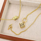Clean, crisp shot of the necklace laid flat or worn, against a solid neutral background, focusing on the iconic pendant.
