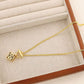 Clean, crisp shot of the necklace laid flat or worn, against a solid neutral background, focusing on the iconic pendant.