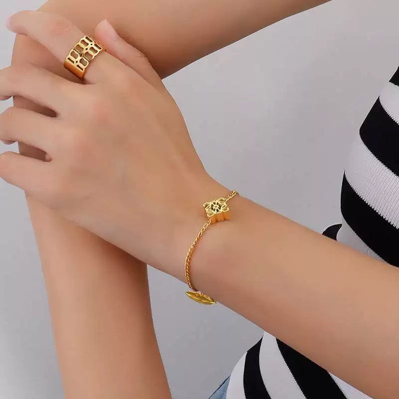 The bracelet displayed next to a modern ceramic piece or on a page of an architectural digest, reinforcing its artistic and design-forward essence