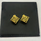 Clean, direct shot of a single earring against a neutral background, highlighting the smooth rhombus shape and the intricate openwork logo.