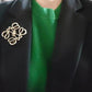  Image showing the brooch creatively styled on a handbag strap, a beret, or a plain scarf.