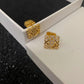 A clean, high-resolution shot of the Loewe Gold Geometric Earrings on a neutral background, showcasing their geometric shape and gold finish. Alt text: "Loewe Gold Geometric Earrings - Luxury Geometric Earrings for Women."