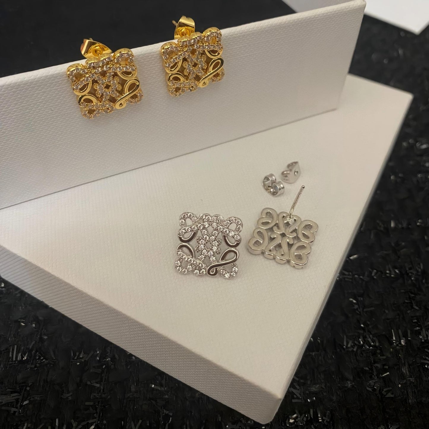 Close-up view highlighting the intricate geometric design and smooth gold plating. Alt text: "Detailed View of Loewe Geometric Earrings in Gold - High-Quality Craftsmanship."