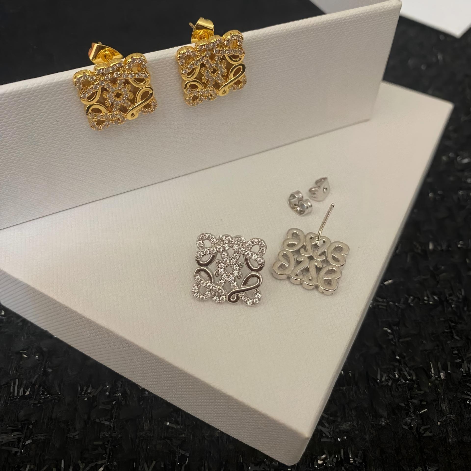 Close-up view highlighting the intricate geometric design and smooth gold plating. Alt text: "Detailed View of Loewe Geometric Earrings in Gold - High-Quality Craftsmanship."