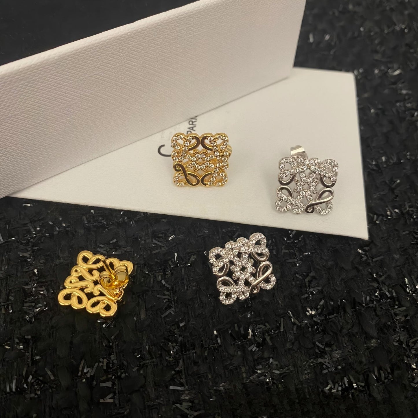 Close-up view highlighting the intricate geometric design and smooth gold plating. Alt text: "Detailed View of Loewe Geometric Earrings in Gold - High-Quality Craftsmanship."