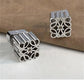 Close-up focusing on the geometric pattern and smooth finish of the metal.