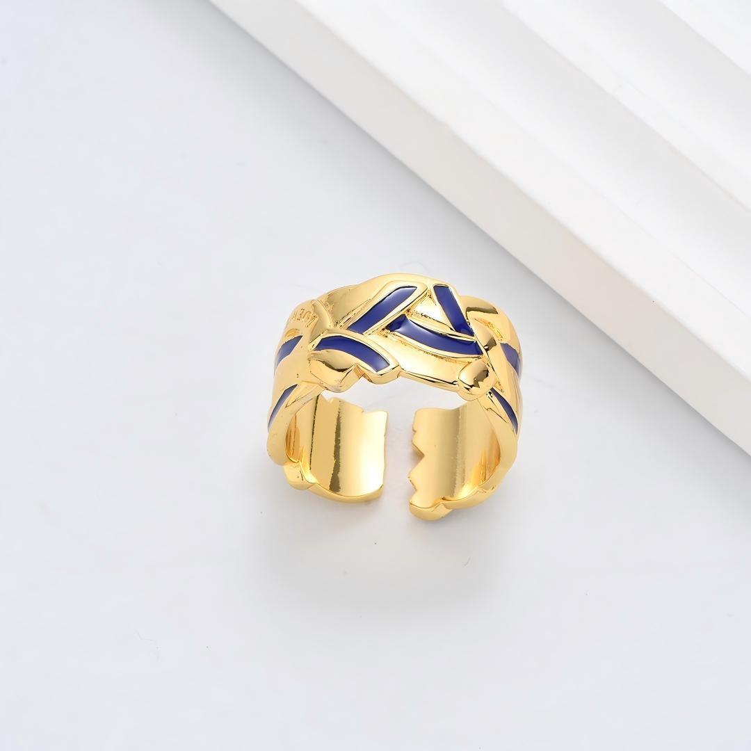 Clean, angled shot of the ring on a finger or stand, showcasing the square silhouette and intricate hollow pattern against a solid background.