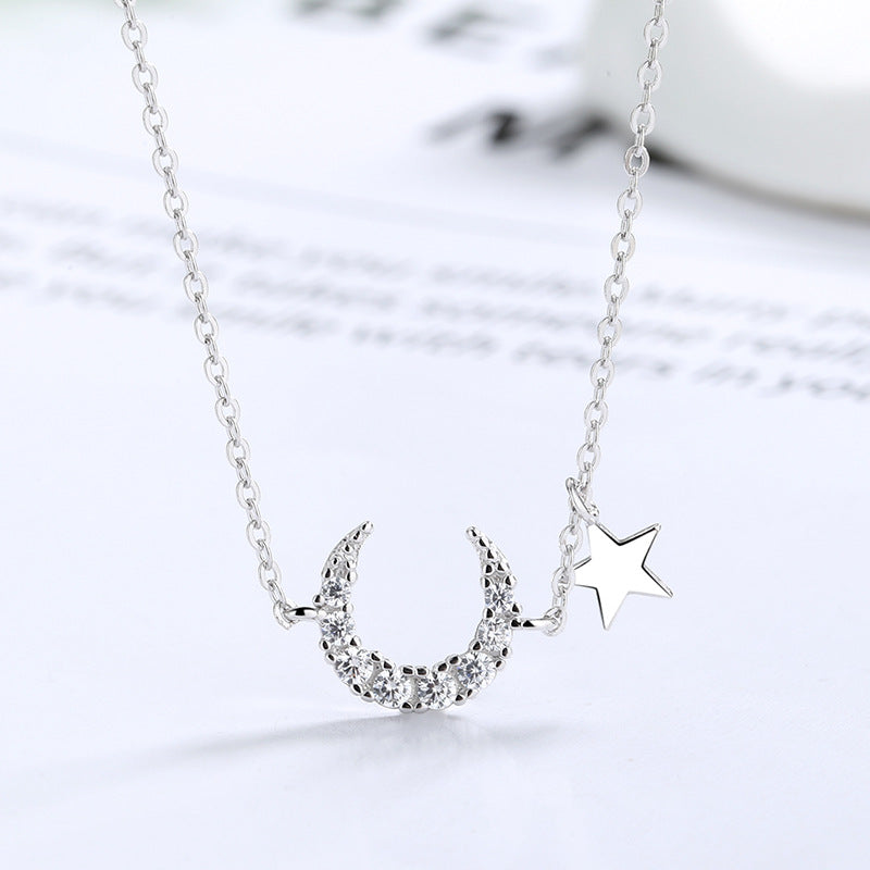  Moon pendant on soft blue background. Alt: “Luna Glowing Stone Moon Necklace – Celestial Jewelry.”