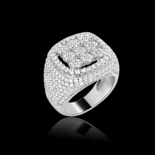 Silver ring with diamond accents on a black background