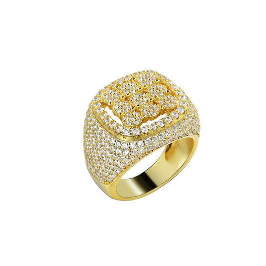 Gold ring with diamond accents on a white background