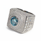 Luxury ring with a large blue gemstone and diamond-studded band on a white background