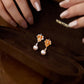 “Maple Whisper Freshwater Pearl Earrings – gold-plated sterling silver dangle design”
