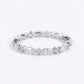 Silver ring with marquise-shaped gemstones on a white background
