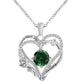 Heart-shaped silver pendant with green gemstone and 'I love you' engraving on a white background