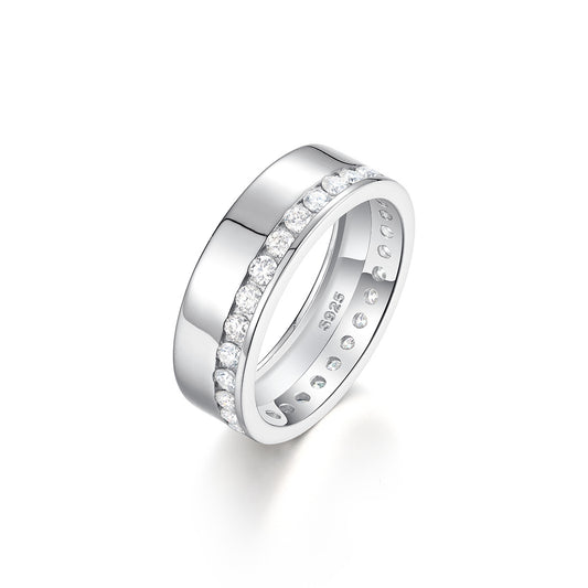 Side-by-side flat lay featuring masculine and feminine ring styles on a neutral backdrop. Alt: “Men and Women's Moissanite Eternity & Engagement Rings – Unisex Collection.”