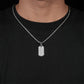 Sterling silver men's chevron tag pendant with embedded diamonds from Zerra Jewelry, showcasing intricate design and sparkling accents.