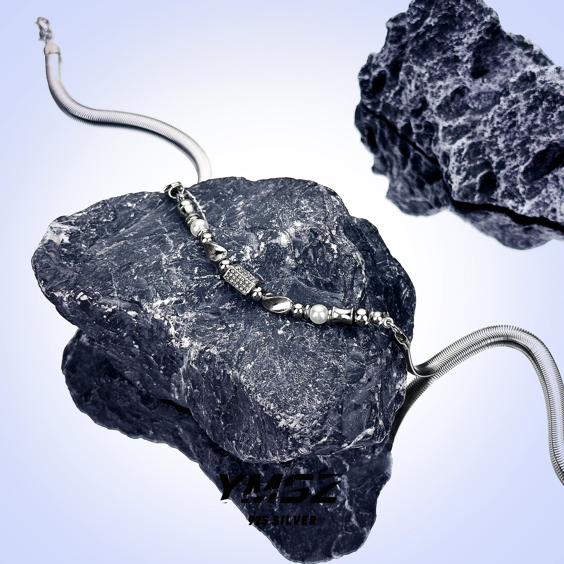 “Close-up detail of sterling silver beads and snake chain premium finish”