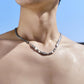 “Male model wearing sterling silver beaded snake chain minimalist streetwear”