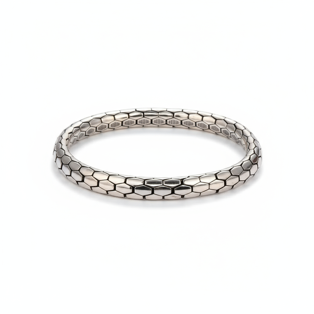 Minimalist Snake Pattern BraceletSilver bracelet with honeycomb pattern on a white background