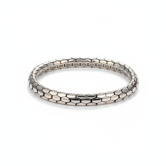 Minimalist Snake Pattern BraceletSilver bracelet with honeycomb pattern on a white background