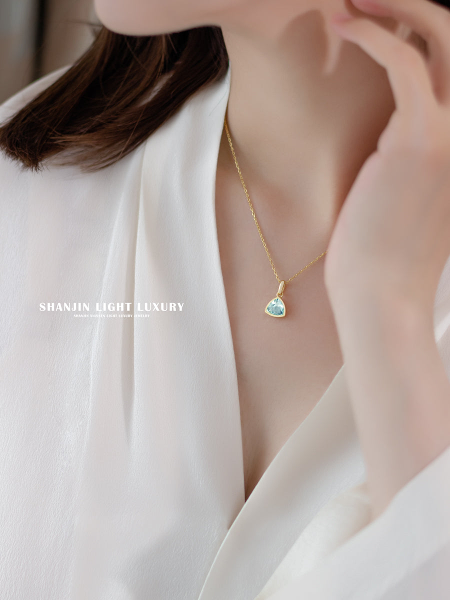 Necklace with a heart-shaped pendant worn by a person in a white outfit, with 'SHANJIN LIGHT LUXURY' branding.