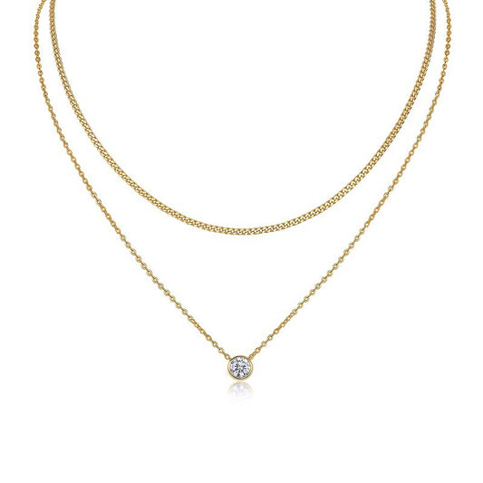 Clean white background — the bezel set moissanite solitaire on a fine chain layered with a chunky curb chain on a bust form. The smooth, modern bezel contrasts beautifully with the bold, textured curb links. Together, they create a balanced mix of delicate and edgy.
