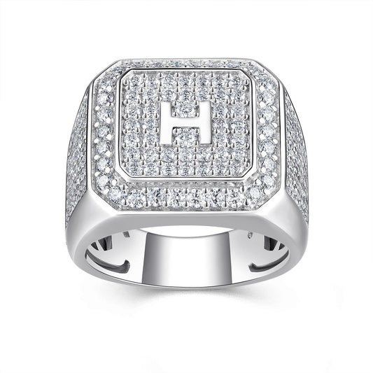 Silver ring with 'H' emblem on a white background