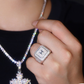 Close-up of a hand wearing a diamond ring with a blurred background