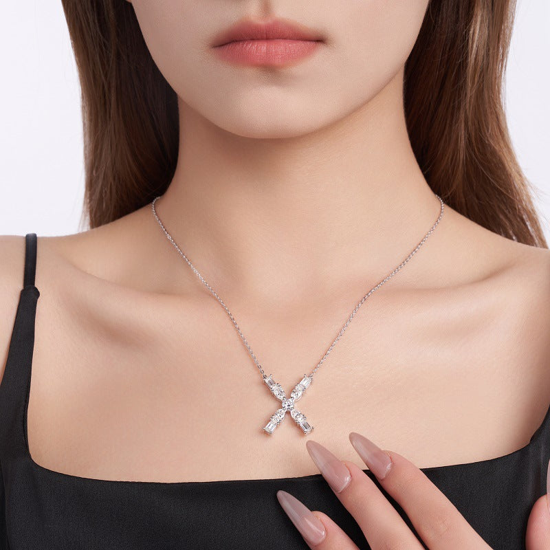 Female model wearing the necklace on bare skin or with an outfit.