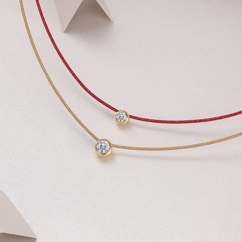 Extreme close-up of the rope pendant and moissanite accent.