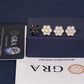 Four floral earrings on a display card with GRA certification below.