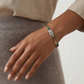  Include close-up shots showing the colorful stones against the skin and wider shots showing the bracelet as part of an outfit.