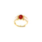 Gold ring with a red gemstone on a white background