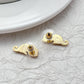  Earrings on seafoam background, showcasing seahorse with enamel and crystal eye. Alt: “New Kate Spade Seahorse Stud Earrings – Enamel Ocean Jewelry.”