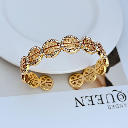 Cuff displayed on a dark, elegant surface with a subtle “NEW” badge or clean styling to emphasize its freshness.