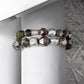 Bracelet with geometric beads on a white surface