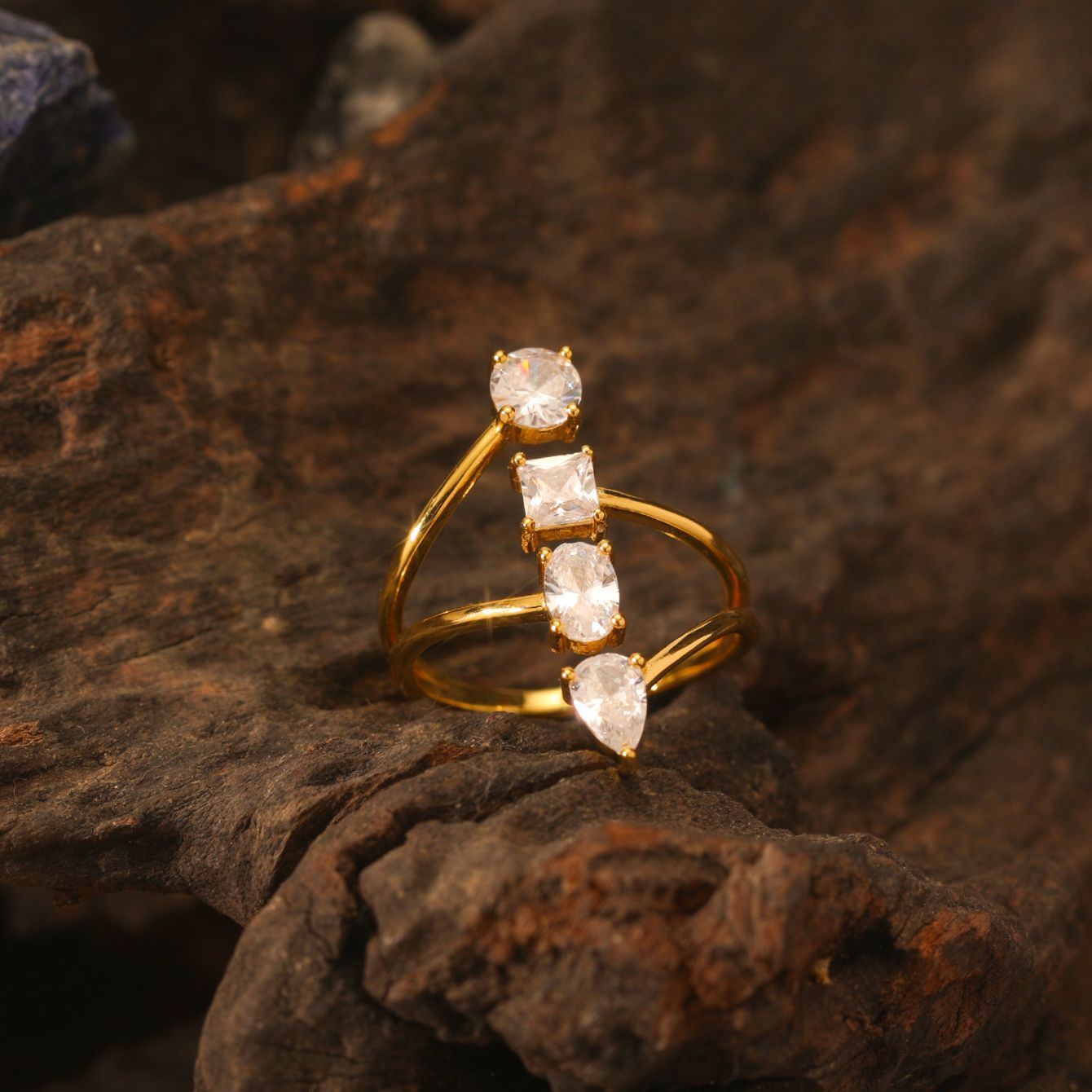 Yellow gold open-cut ring on neutral background, showing split shank design. Alt: “Open-Cut Moissanite Engagement Ring – 18K Yellow Gold Split Shank.”