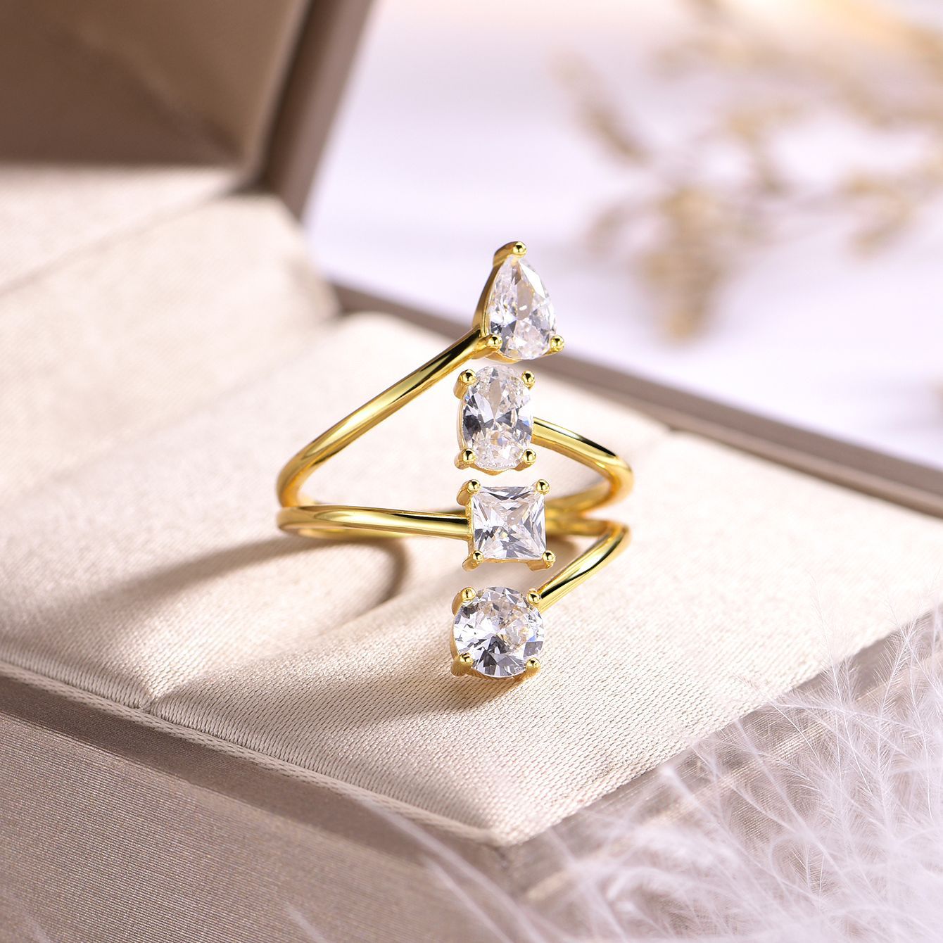 Yellow gold open-cut ring on neutral background, showing split shank design. Alt: “Open-Cut Moissanite Engagement Ring – 18K Yellow Gold Split Shank.”