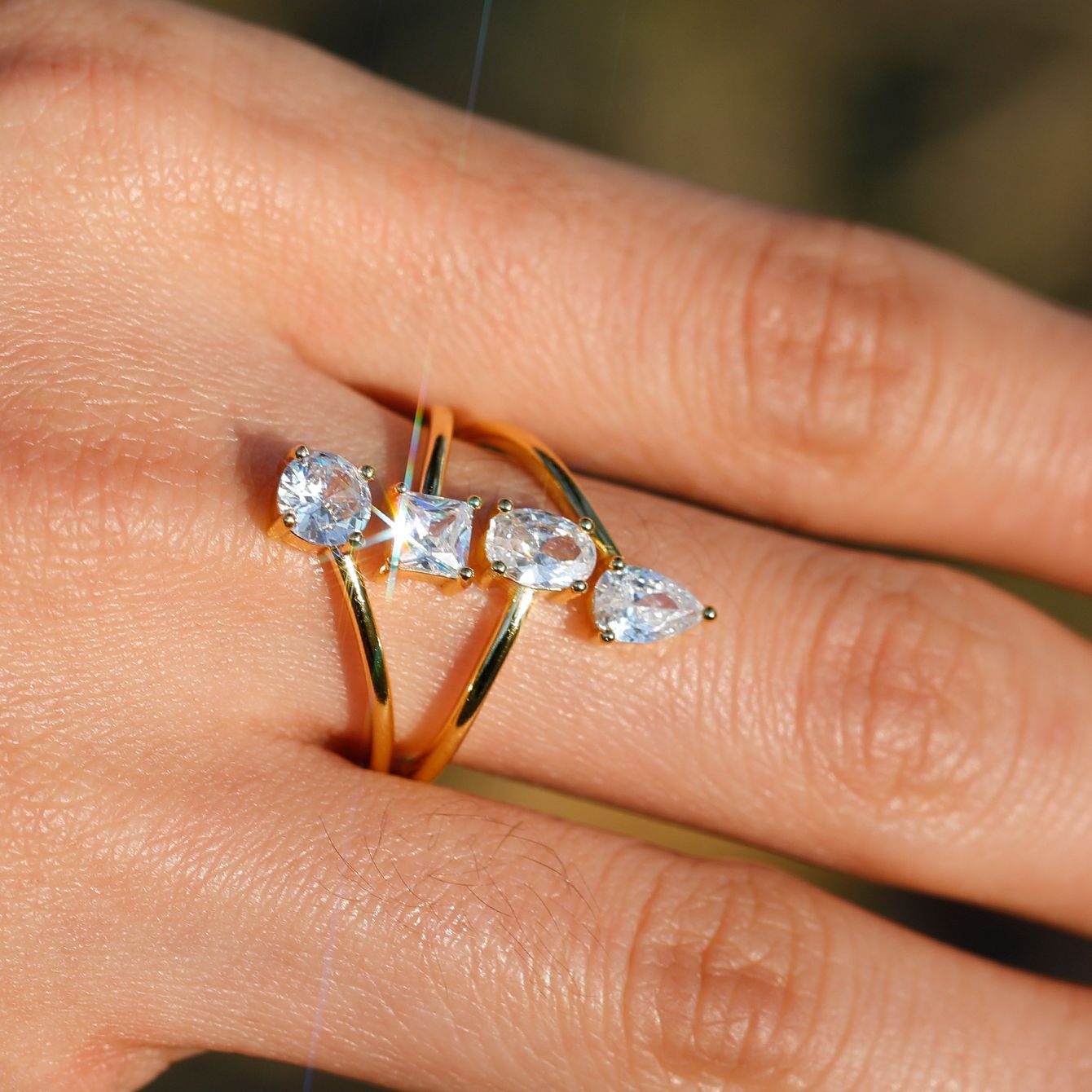 Ring worn as modern bridal statement. Alt: “Architectural Elegance: Split Shank Moissanite Ring.”