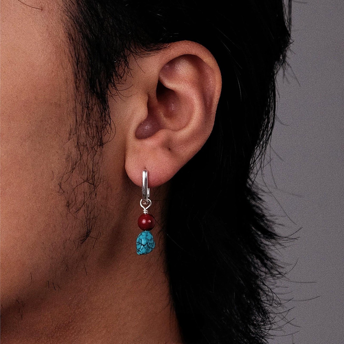 “Unisex Tibetan style earrings worn by male model streetwear styling”