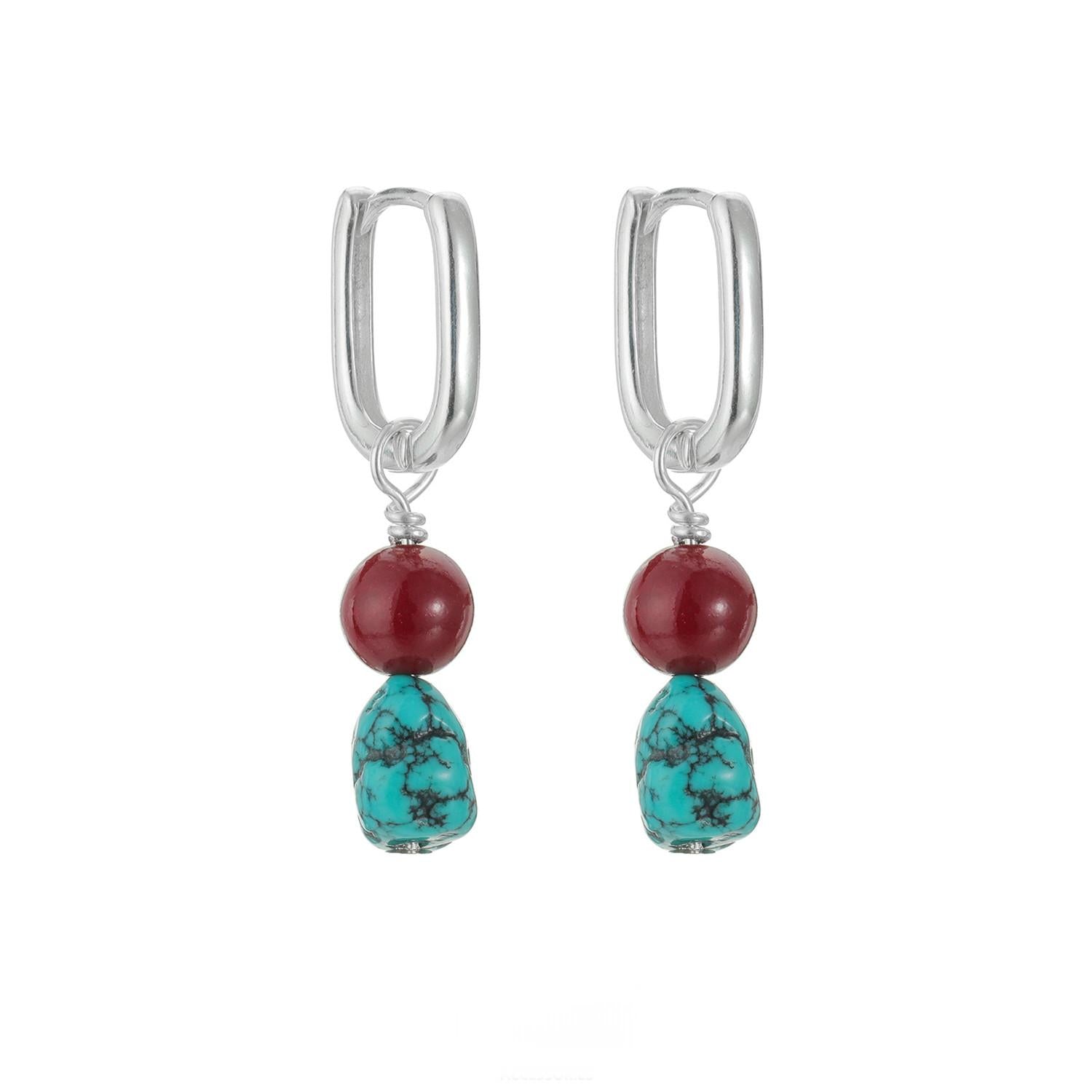“Turquoise and cinnabar earrings sterling silver flat lay Tibetan style”