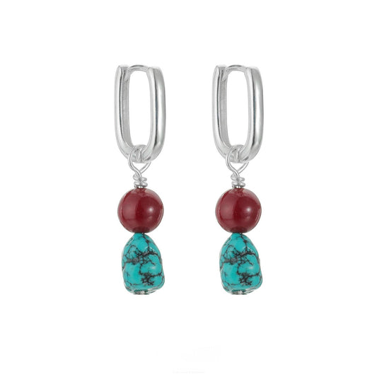 “Turquoise and cinnabar earrings sterling silver flat lay Tibetan style”
