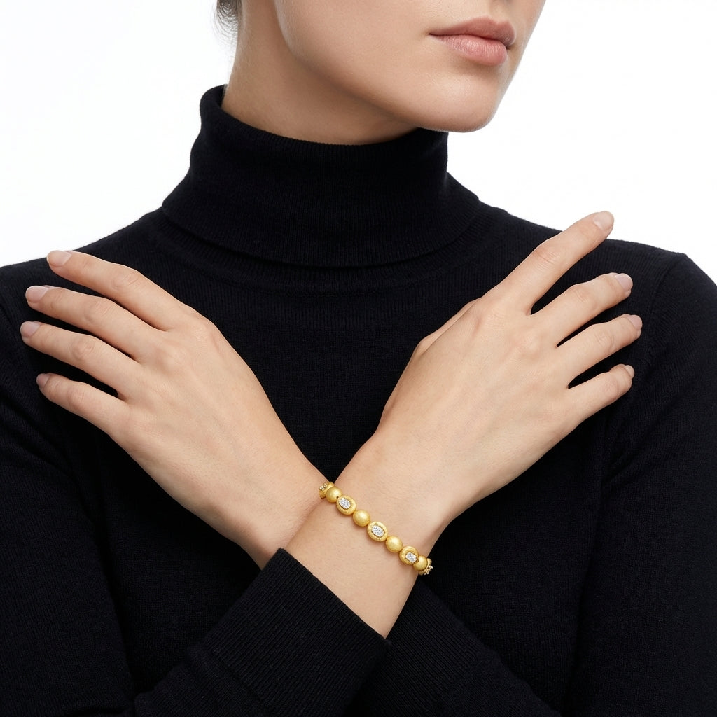 Female model in black turtleneck, focus on hands wearing bracelet, white background, soft studio lighting, quiet luxury style.