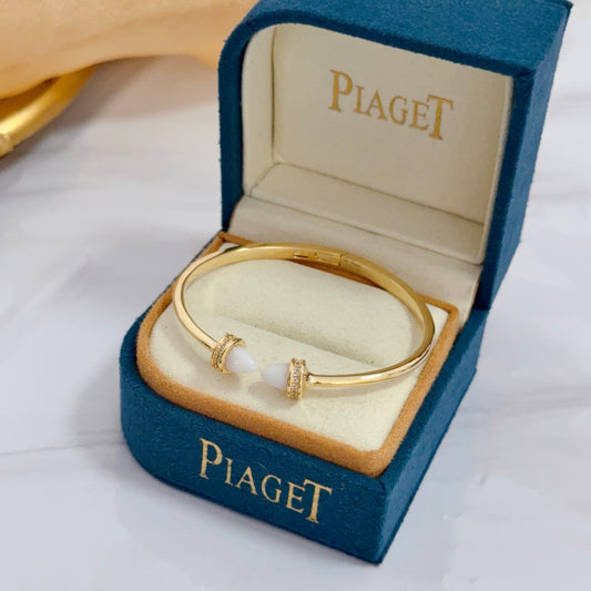 “Possession style open bangle bracelet high-end custom version flat lay”